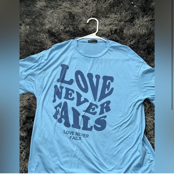 Blue Graphic Tee with 'Love Never Fails' Print - Picture 1 of 2